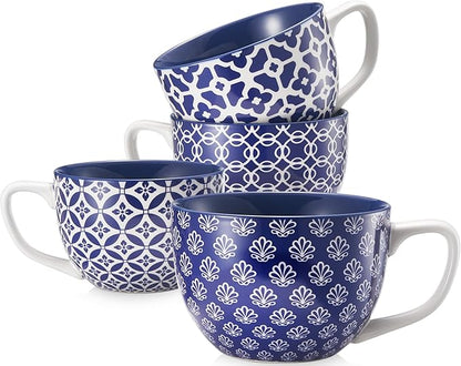 Set of 4 blue ceramic coffee mugs with handles and white geometric patterns.