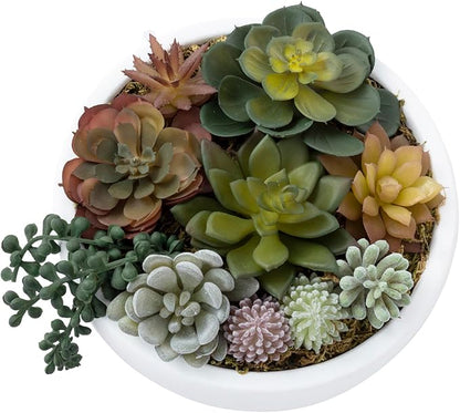 Round white concrete bowl with mixed faux succulents in green, gray, and blush tones