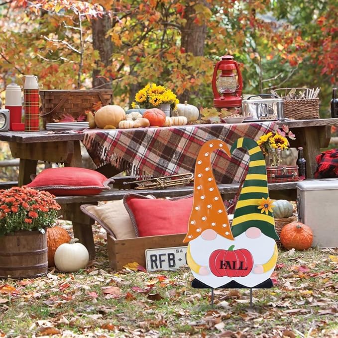 Outdoor fall gnome stake featuring orange polka-dot body, green striped hat, and “FALL” pumpkin