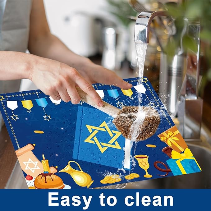 Hands cleaning a blue Hanukkah plastic placemat with “Light it up” center