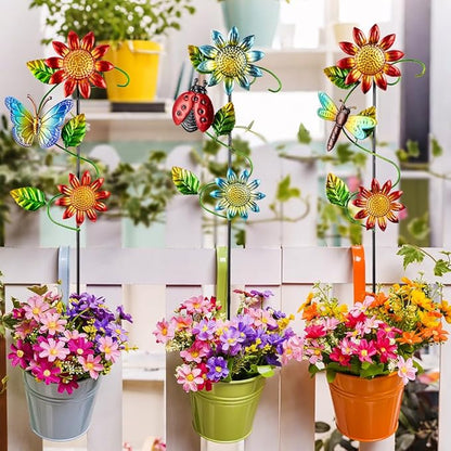 Three metal garden stakes with sunflower blooms, butterflies, ladybug, and dragonfly