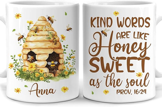 White ceramic bee mug with beehive illustration, honey flowers, and Anna name text