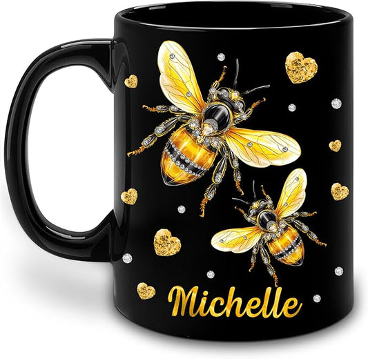 Black ceramic coffee mug with bee artwork and gold hearts, personalized Michelle