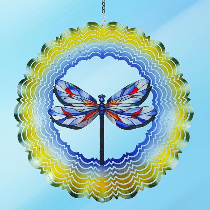 Hanging dragonfly wind spinner centered on blue sky, blue/red wings with scalloped ring