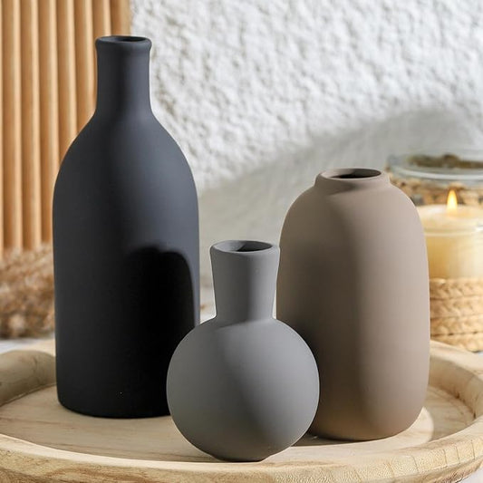 Ceramic vase set of three in matte dark gray, light beige, and light gray, rounded forms
