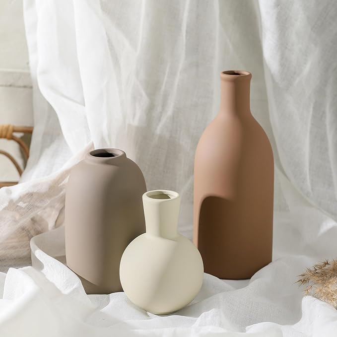 Set of 3 ceramic vases on fabric: terracotta tall, dark taupe bottle, cream round
