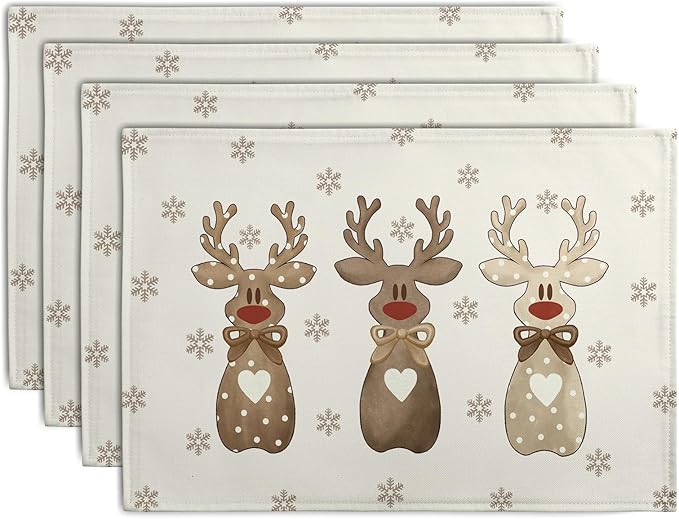 Set of four beige linen placemats with brown reindeer and gray snowflake print