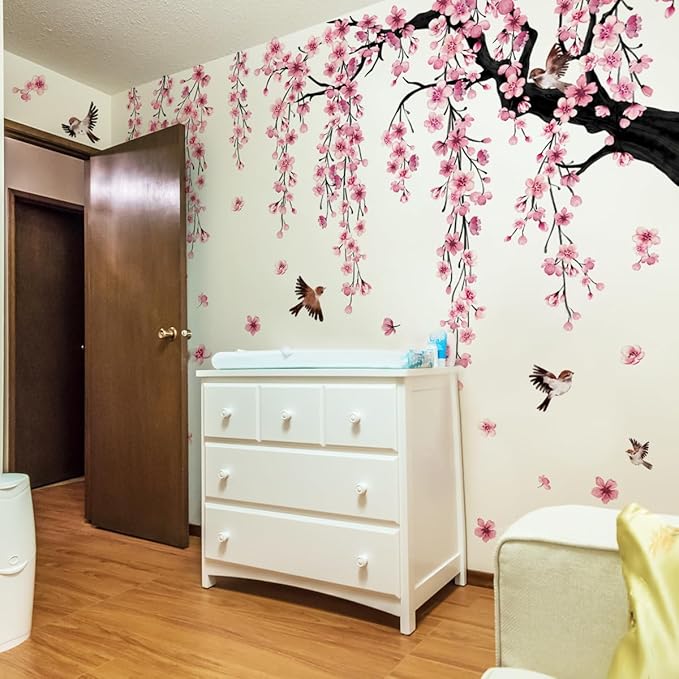 Pink floral wall decals: cherry blossom branches with birds scattered across the wall