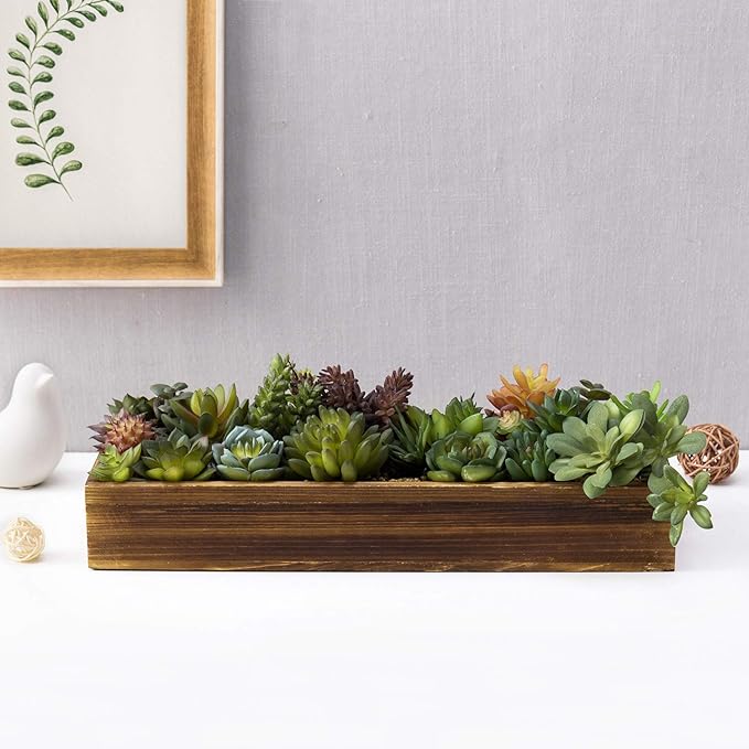 Long rustic brown wooden planter with faux succulents, mixed green and dark purple leaves
