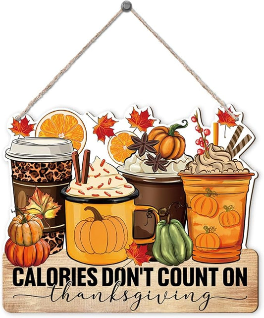 Thanksgiving door hanging sign with pumpkins, coffee cups, and 'Calories don't count on Thanksgiving'