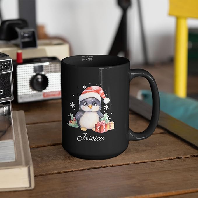 Black ceramic mug with penguin Santa hat design and name Jessica