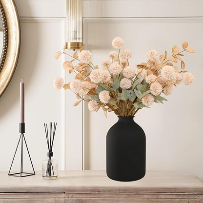 Beige faux pom-pom flower and gold eucalyptus stems centerpiece in vase