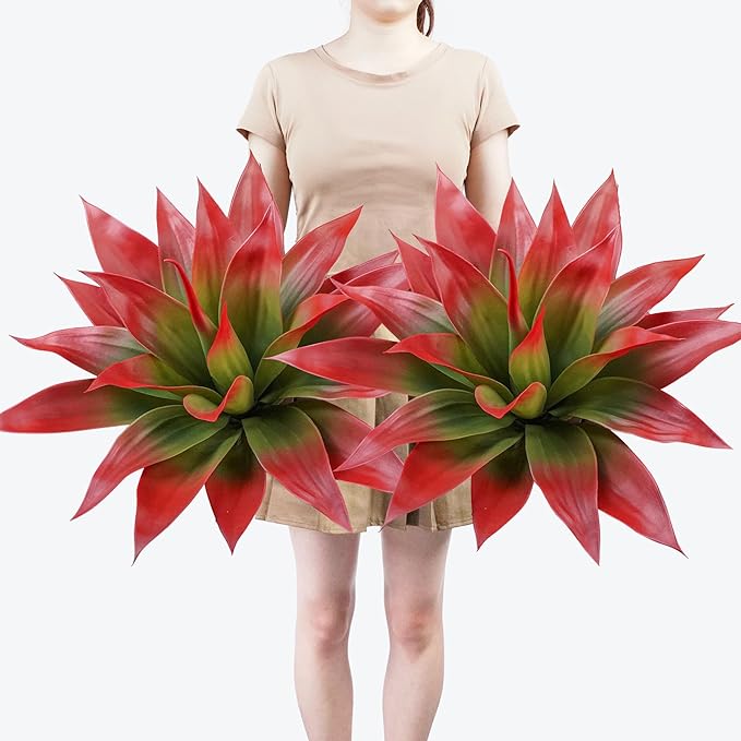 Faux agave plants with wine-red and green spiky leaves in two planters