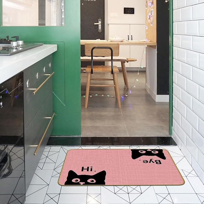 Pink welcome cat doormat with black cat faces and “Hi/Bye” text, flat rectangle