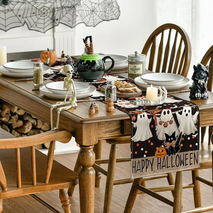 Halloween table runner with ghosts, black cat, pumpkins, and “Happy Halloween” on the front