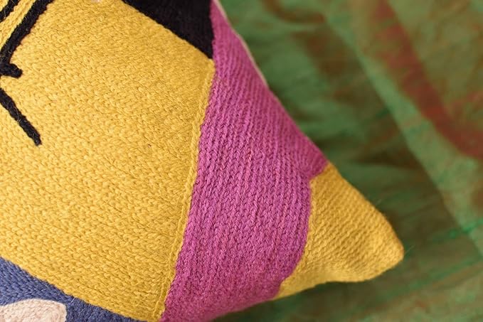 Abstract embroidered pillow cover corner with yellow and bright pink panels