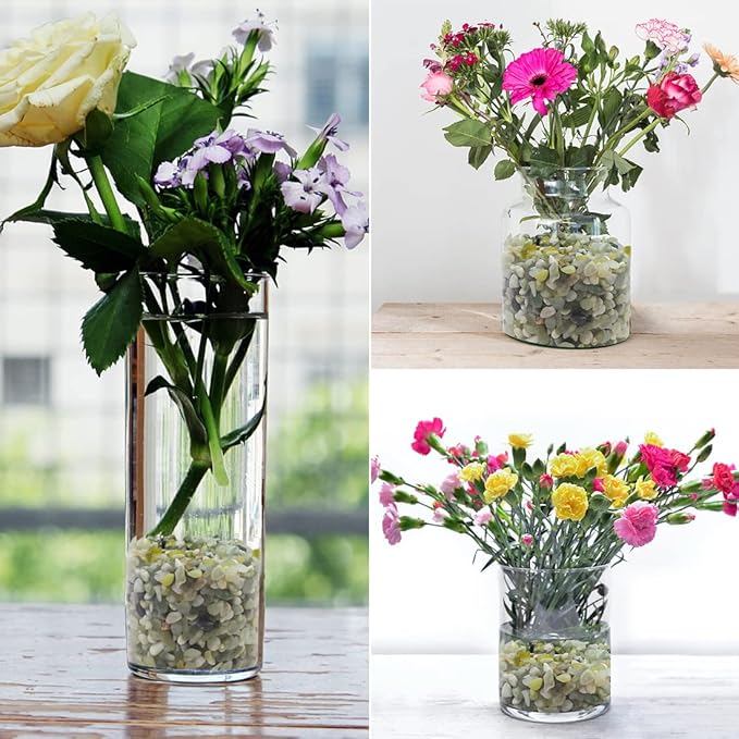 Clear glass vase filled with pale green and white polished stone pebbles