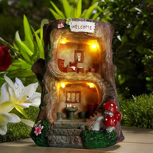 Brown fairy garden house sculpture with solar lights glowing from two story openings