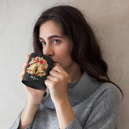 Black ceramic mug with bell and bow print, Milyan script, sipped from