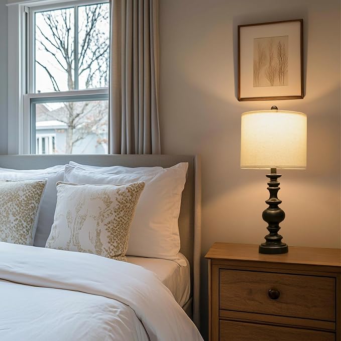 Farmhouse bedside table lamp with dark resin base and beige linen drum shade