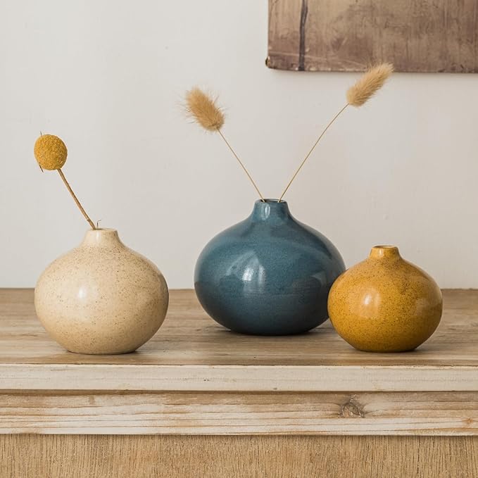 Set of 3 mini ceramic bud vases with pampas stems: blue, cream, and gold.