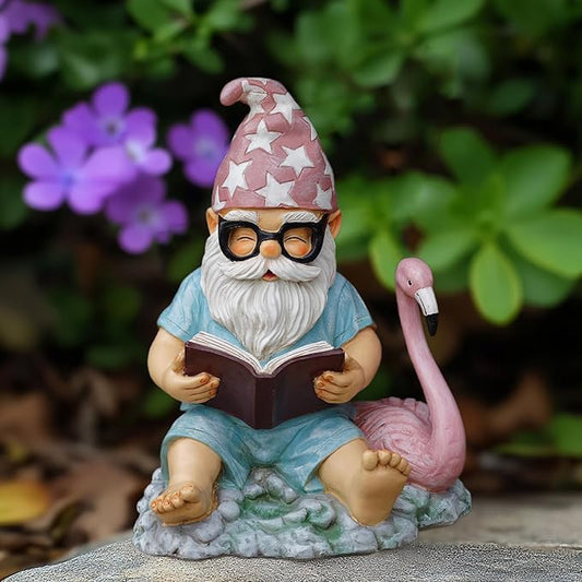 Garden gnome resin statue reading book with pink flamingo figurine, front view