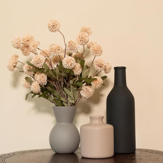 Ceramic vase set with three matte vases (gray, cream, black) and faux chrysanthemum stems
