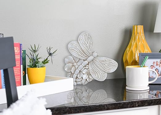 Grey dragonfly cast resin stepping stone with layered petal texture and raised wings