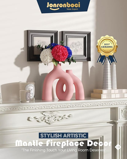 Light pink matte ceramic hug vase with conjoined donut form, mantle decor