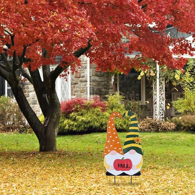 Autumn fall gnome garden stake in orange polka-dot robe with green striped hat and red “FALL”