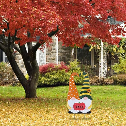 Autumn fall gnome garden stake in orange polka-dot robe with green striped hat and red “FALL”