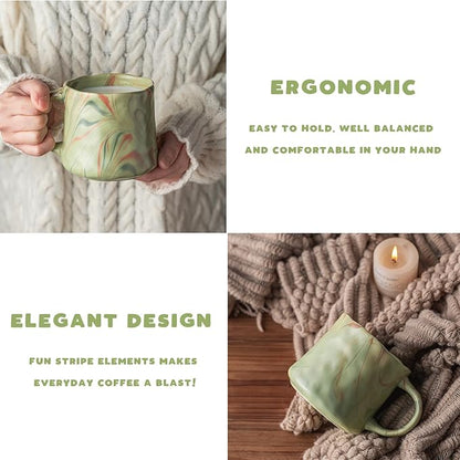 Mint green ceramic coffee mug with abstract red and white pattern and wide handle