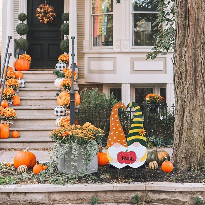 Front-facing fall gnome stake with orange polka-dot robe, green striped hat, and “FALL” pumpkin