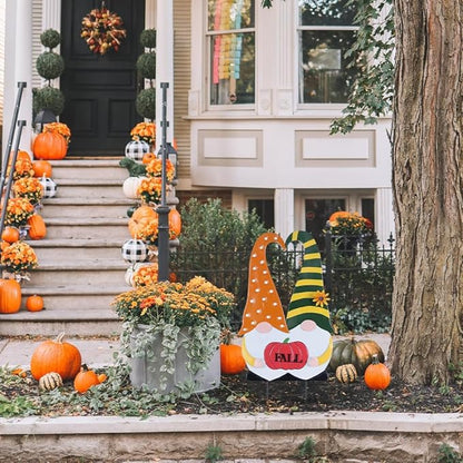 Front-facing fall gnome stake with orange polka-dot robe, green striped hat, and “FALL” pumpkin