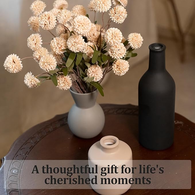 Ceramic vase set with gray and black vases holding faux chrysanthemum stems