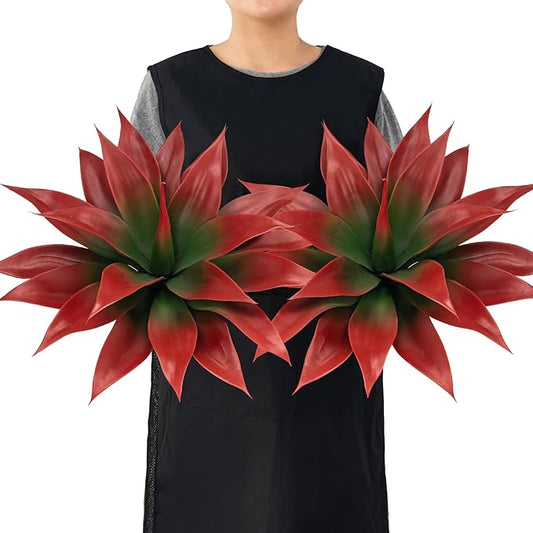 Wine-red faux agave plant with green centers, spiky fan-shaped leaves in pot