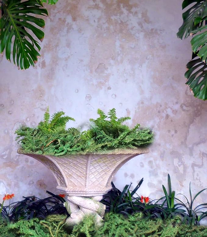 Dark green artificial moss patch in a white textured vase planter