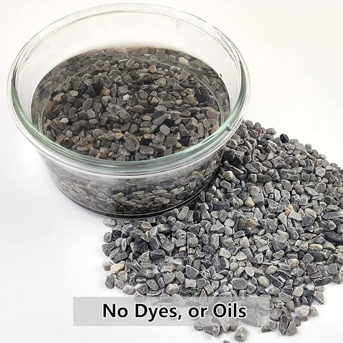 Gray polished pebbles in a clear jar and a loose gravel pile