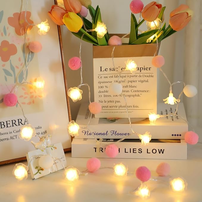 Battery string lights with pink pom-pom balls and warm rose-shaped LED bulbs