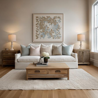 Two farmhouse table lamps on side tables with beige linen drum shades