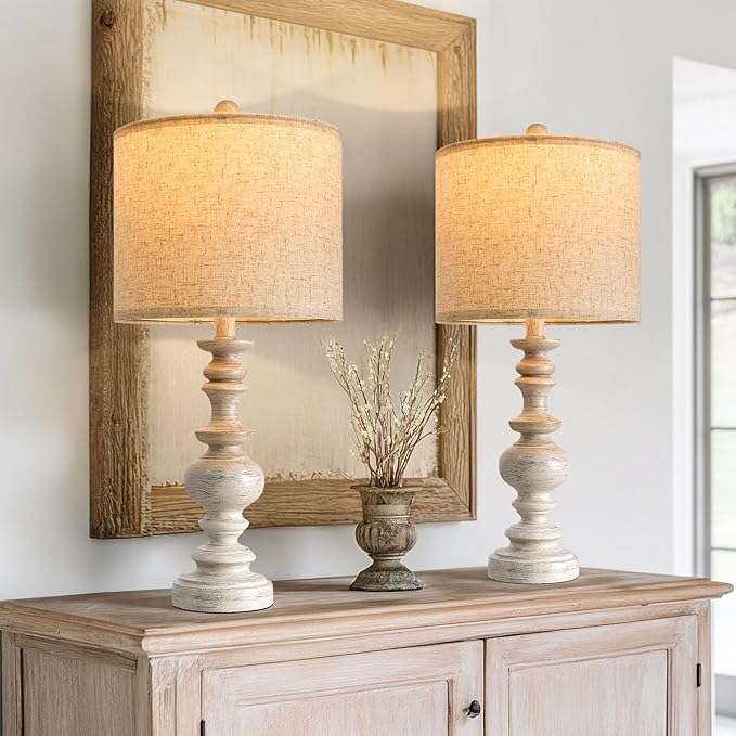 Set of two rustic table lamps with beige linen shades and whitewashed resin bases