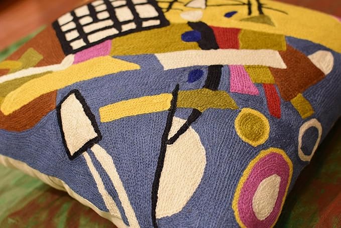 Abstract embroidered pillow cover diagonal view with multicolor geometric blocks