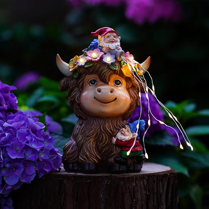 Highland cow solar garden statue with gnome, tiny dwarf, and glowing fairy lights on stump