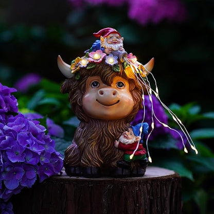 Highland cow solar garden statue with gnome, tiny dwarf, and glowing fairy lights on stump