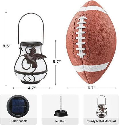 Black metal solar lantern with angel motif, arched handle, and hanging loop size view
