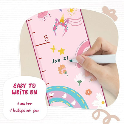 Hand writes on pink unicorn height chart with stickers and rainbow design; easy write panel.