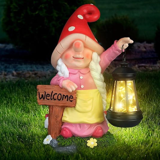 Pink outdoor garden gnome statue holding a solar LED lantern with a Welcome sign