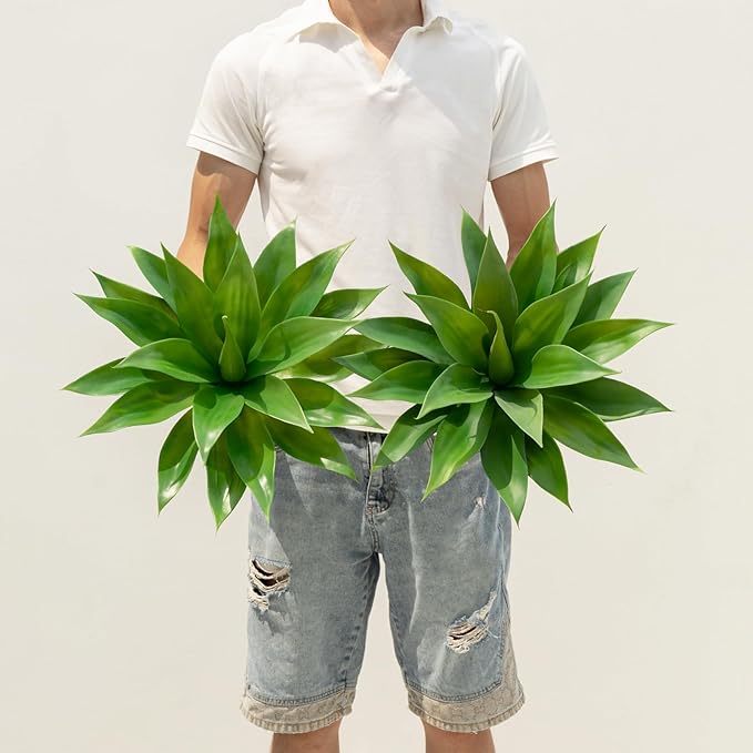 Pair of green faux agave plants with spiky leaves in pots