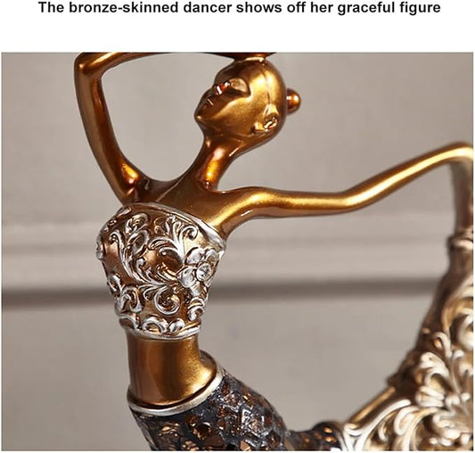 Gold and bronze dancer figurine close-up with ornate etched resin torso and skirt