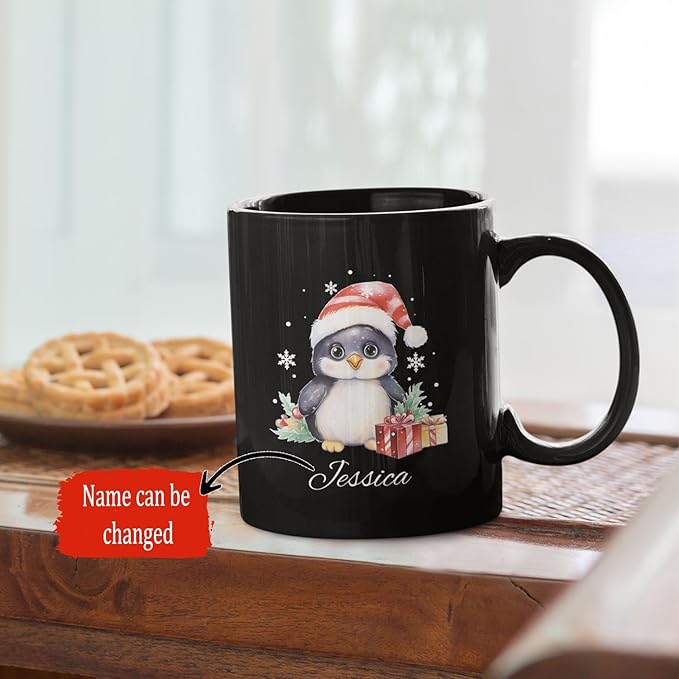 Black mug with penguin in Santa hat and scripted name Jessica
